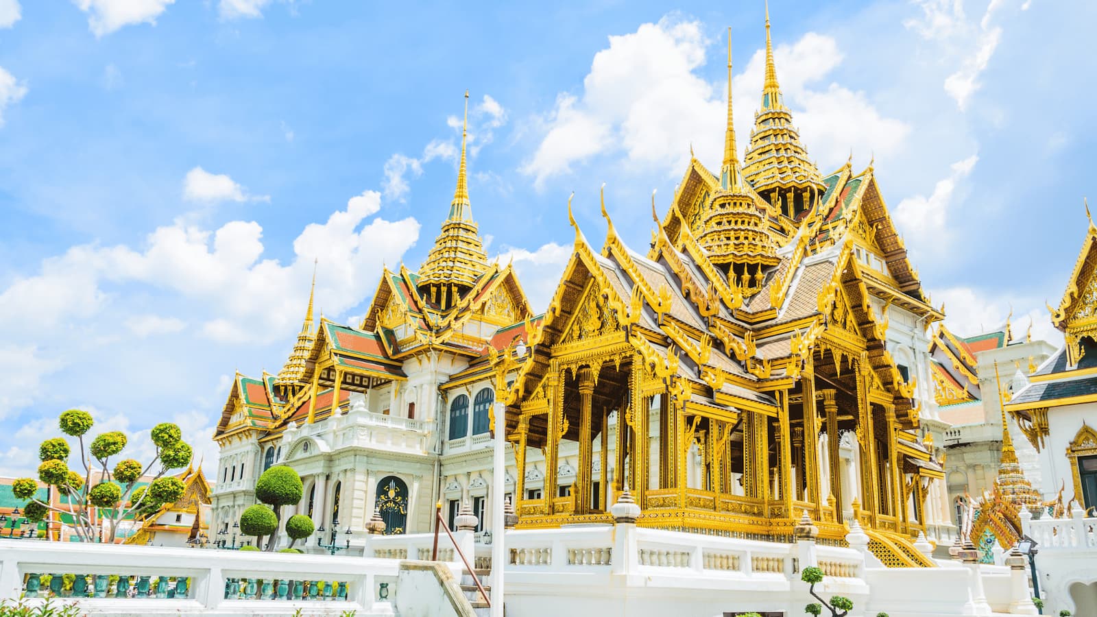 Wat Arun temple in Bangkok along the Chao Phraya river at golden hour