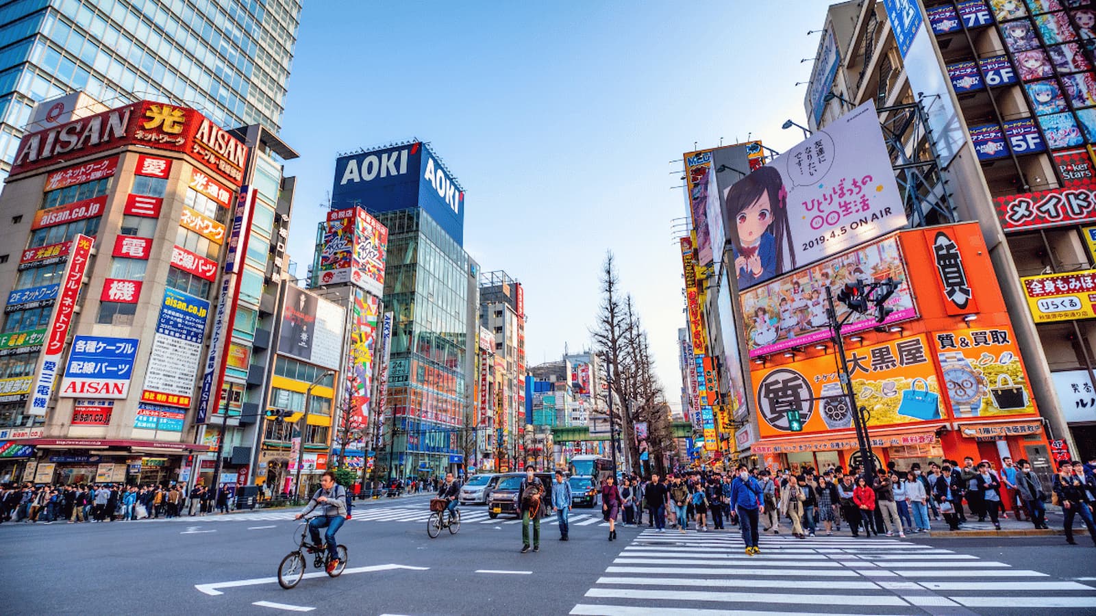 Vibrant Tokyo street scene with neon signs and crowds